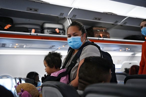 Lisa Te Tai and her granddaughter Manaia Taalili board their flight. 
