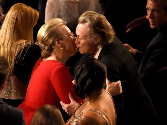 Meryl Streep, left, greets Christopher Walken in the audience.