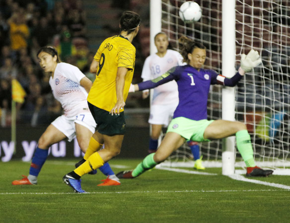 Caitlin Foord slots home Australia's second from an acute angle.