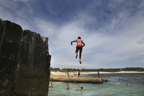 Crowds find refuge from the oppressive heat, swimming at Yarra Bay.