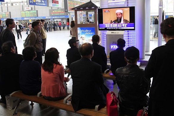 South Koreans watch a TV broadcasting a report of Osama bin Laden's death.