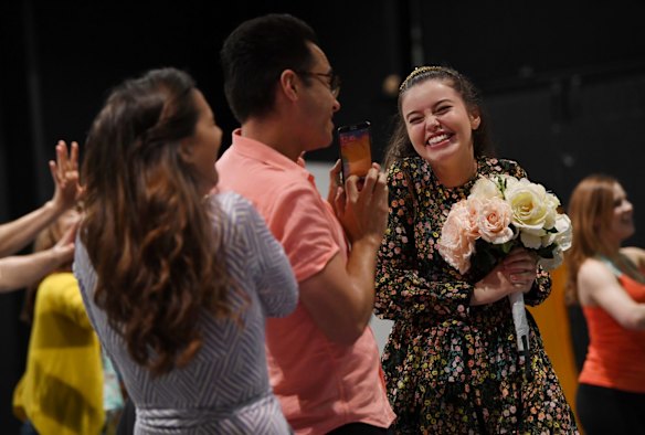 Actress Maggie McKenna, in the lead role of Muriel, performs with other cast members during a rehearsal.