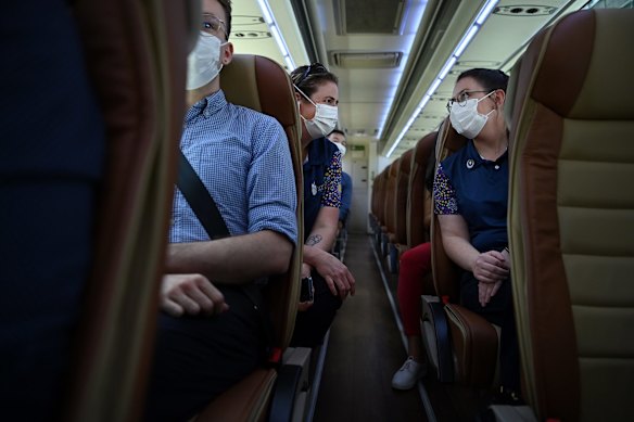 St Vincent's Hospital Wards Person Supervisor Eliza Attwood (right) and St Vincent's Hospital Incident Disaster Manager Rachel Macfarlane (left) on the bus at St Vincent's Hospital in Darlinghurst that will take staff to RPA's vaccination hub where the will receive the Pfizer COVID-19 vaccine as one of the frontline health workers.