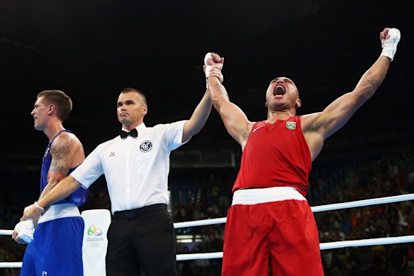Juan Goncalves Nogueira of Brazil celebrates victory over Jason Whateley of Australia in the boxing ring.