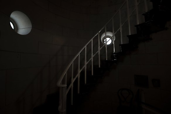 Light seeps in through the small circular windows on the way up to the beacon room.