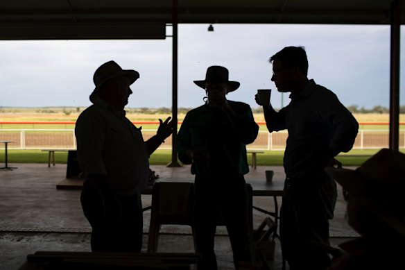 Tambo Mayor Andrew Martin, pilot Phil Owens and Minister for Agriculture and Water Resources David Littleproud in discussion over afternoon tea during a furniture restoration workshop held at the Tambo racecourse in Tambo, Queensland.