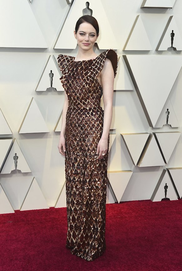 Emma Stone arrives at the Oscars at the Dolby Theatre in Los Angeles wearing Louis Vuitton.