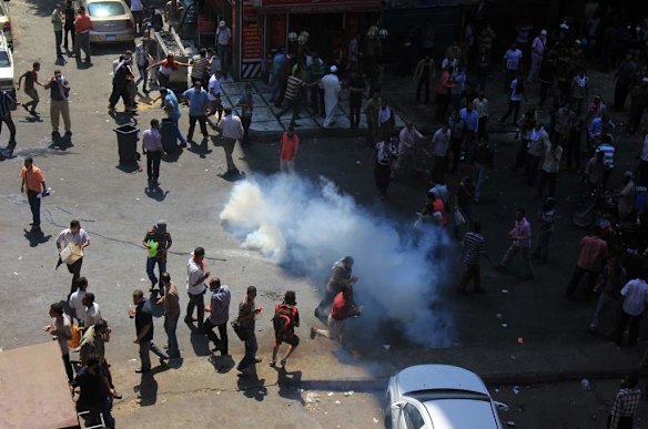 Supporters of Egypt's ousted President Mohammed Morsi clash with security forces near the largest sit-in by supporters of Morsi in the eastern Nasr City district of Cairo, Egypt.