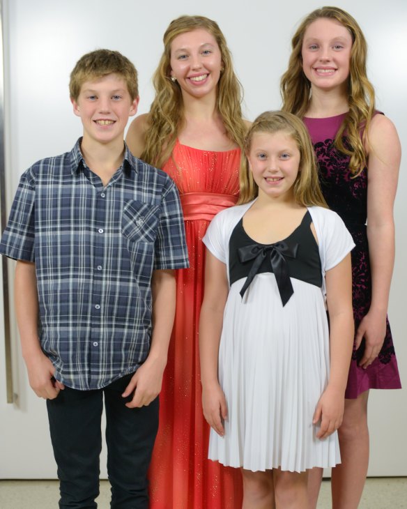 The Smith swimming family: Brendon Smith at age 13 with his older sisters Nerice and Mikayla and younger sister Reidel.