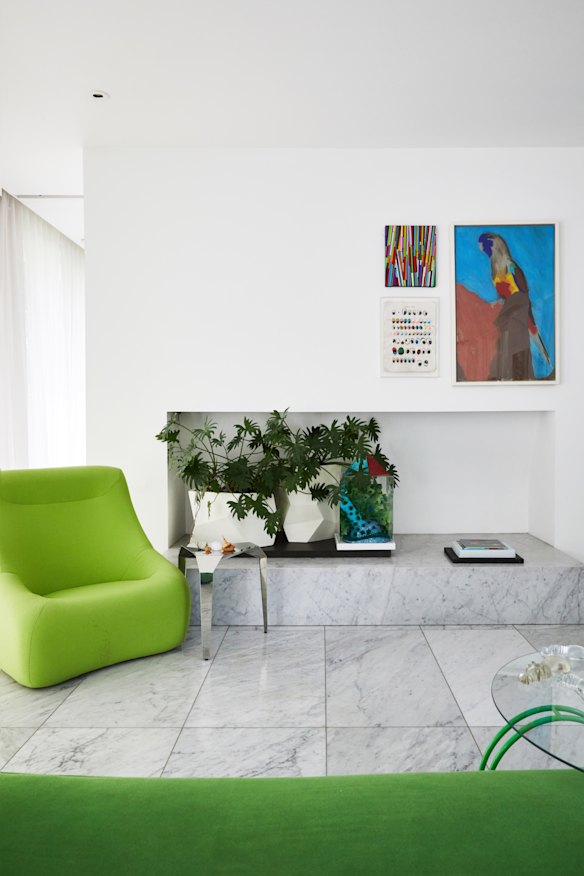 “The plinth is actually a fireplace but I’ve never lit it as I dread the walls becoming a smoky mess. Inside is a treasured peacock bonnet made by my daughter, Stella.”