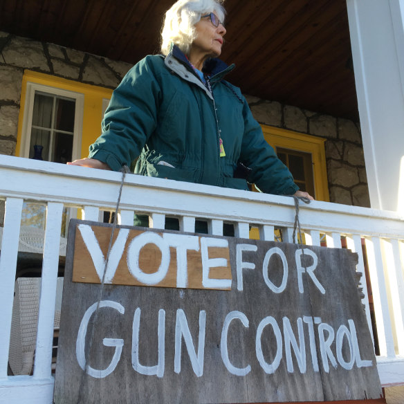 Rose Cathleen Bagin stands on the porch of her home in the Squirrel Hill district of Pittsburgh.