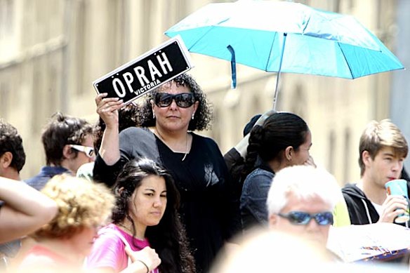Oprah Winfrey fans wait at Federation Square for the show to start.