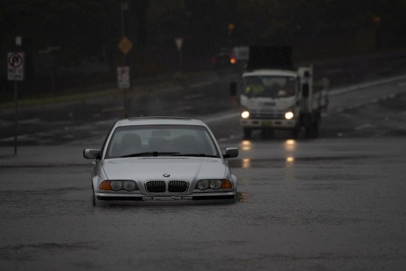 A car is seen partially submerged and abandoned in Roseville.