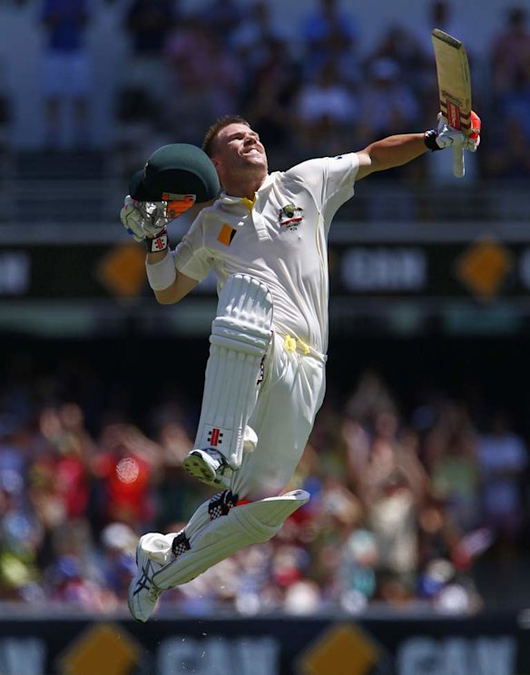 Australia's David Warner celebrates his century.