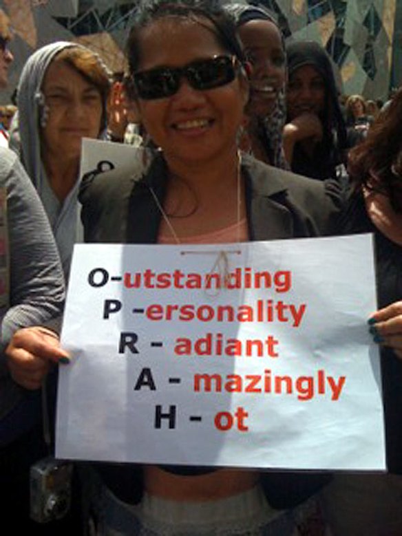 Oprah devotee Evelyn, 48, has been waving her banner since 7am.