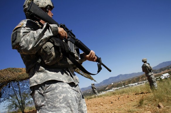 The US National Guard on the Mexican border in Arizona in 2010. Donald Trump plans to redeploy US military personnel from overseas to the border.