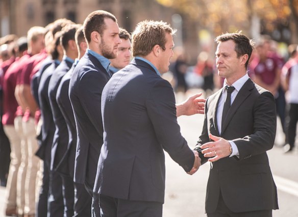 Brett Fulton meets with members of the NSW Blues team and shakes hands with Manly player Jake Trbojevic.