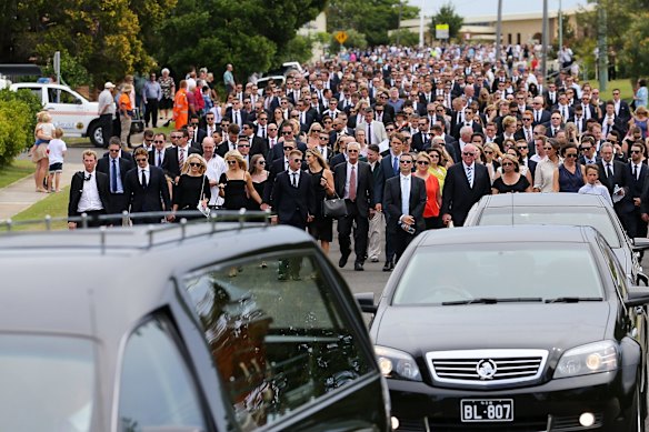 The funeral procession heads down Wallace Street Macksville after the Funeral Service for Phillip Hughes.