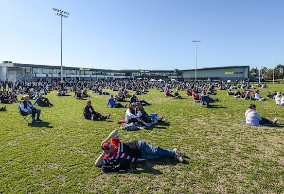 Fans watching the broadcast on the oval.