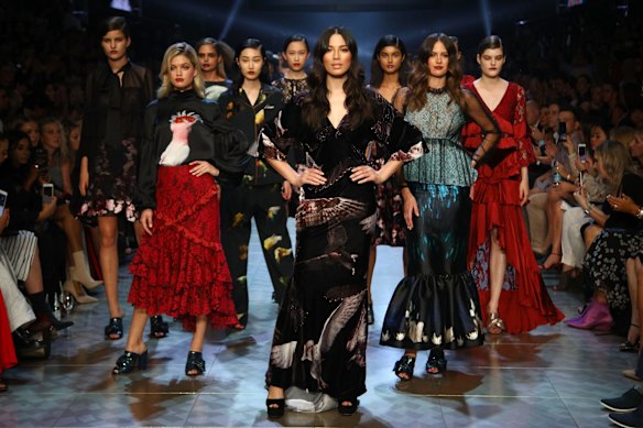 David Jones ambassadors Jessica Gomes (centre) and Jesinta Franklin (right), and model Megan Irwin (left) pose in the finale of the Gala Runway show on Tuesday night.