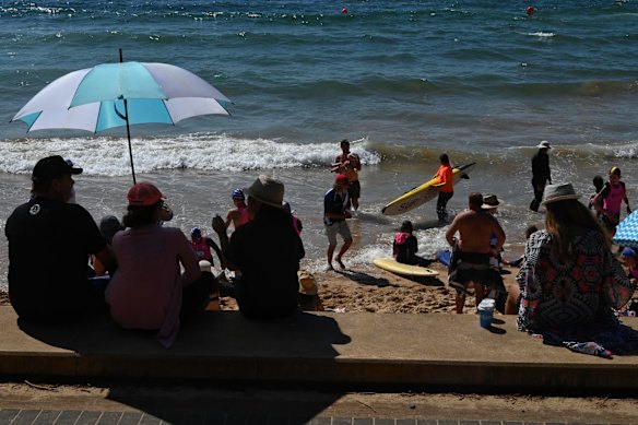 Busy Dee Why Beach on warm long weekend Monday.