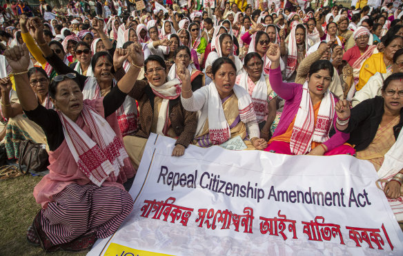 Indian women shout slogans during a protest on Saturday.