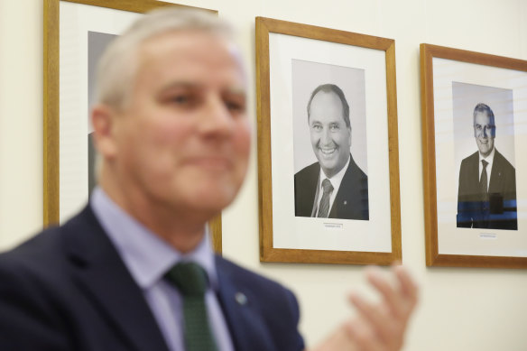 A portrait of former Nationals leader Barnaby Joyce hangs on the wall behind the new Deputy Prime Minister, Michael McCormack. 