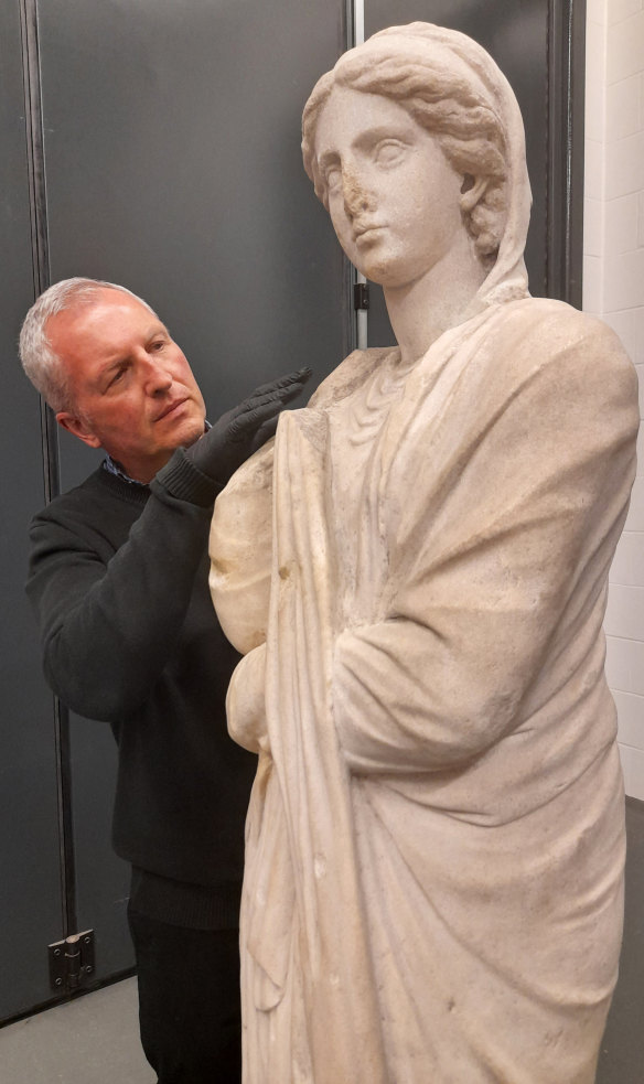 The British Museum’s acting keeper: Greece and Rome, Dr Peter Higgs, prepares Statue of a woman, Parian marble, about 150-100 BCE, for transportation to Australia. 