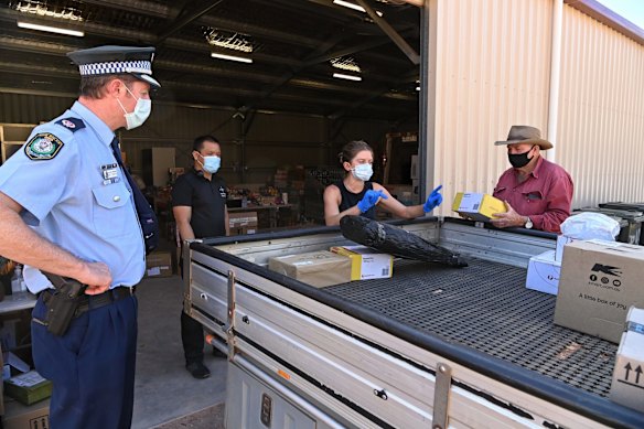 Assistant commissioner Brett Grenntree at the Wilcannia food distribution centre. The police are playing a major role in assisting the Wilcannia community in dealing with a COVID outbreak.