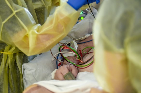 ICU nurses at work on a patient.