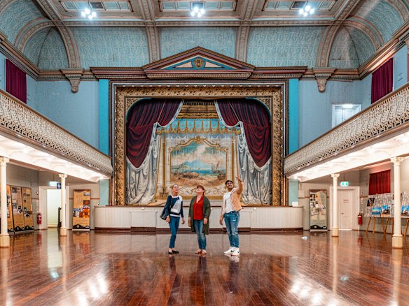 A rare, hand-painted stage curtain is the star attraction of tours of the theatre inside Boulder Town Hall.