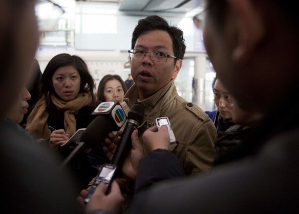 A Malaysian man who says he has relatives on board the missing Malaysian Airlines plane, talks to journalists at Beijing's International Airport Beijing, China.
