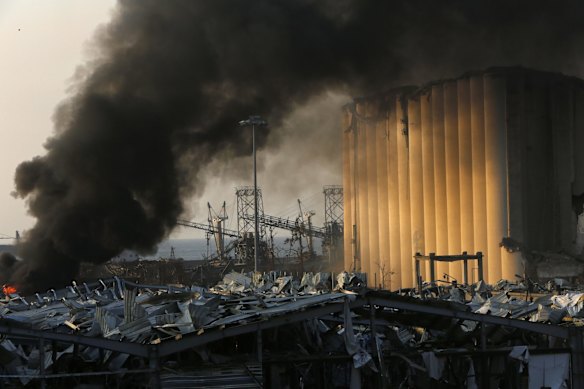 Smoke rises from a port facility.