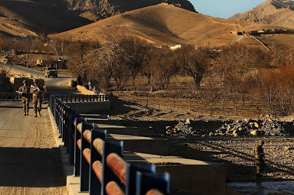 Australian soldiers patrol and search the Puza Bridge for IED's after an insurgent was arrested the night before with explosive matieral at this location. Dai Roshan Area in Uruzgan Province, Afghanistan.