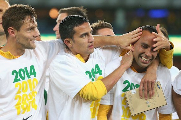 On the podium: Thompson is a popular figure among Socceroos teammates, seen here celebrating qualification for the 2014 World Cup in Brazil.