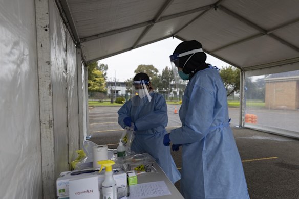 Layal and Sonya wait for patients at the drive-through COVID-19 testing clinic at the Seventh Day Adventist Church in Hoxton Park.