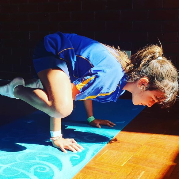 Perth primary school student taking part in PhysZen yoga.