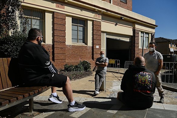 Men waiting for their take away coffee in Bexley during the COVID-19 lockdown, in the Bayside LGA which is under additional restrictions.