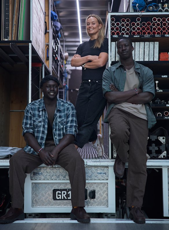 Loang Rout, left, and BK (Buomkuoth) Gatluak with stunt coordinator Philli Anderson at Docklands Studios Melbourne.