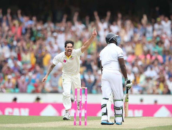 Mitchell Johnson celebrates the wicket of Michael Carberry, out for a duck.