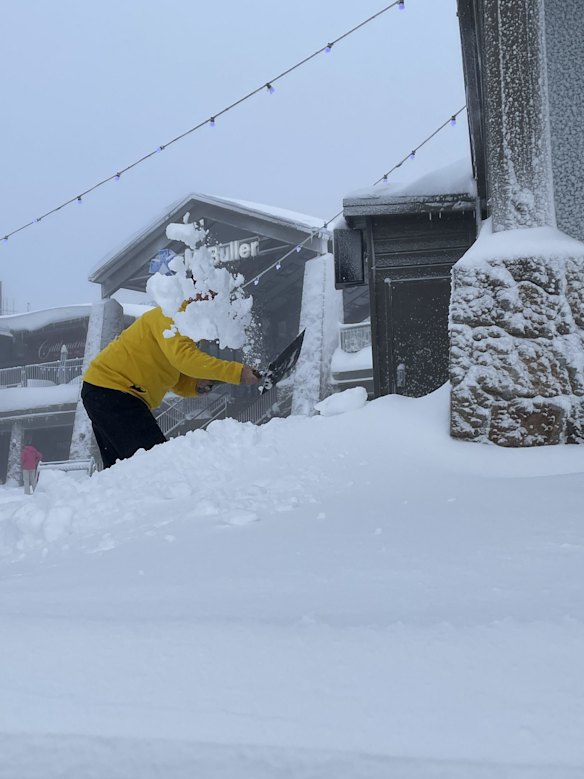 Shovelling record amounts of snow at Mt Buller ahead of the opening weekend.