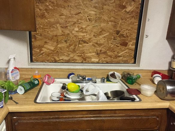 The sink was full of dirty dishes.