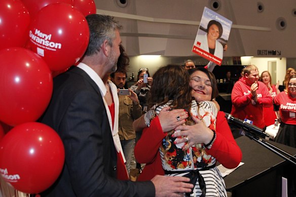 Paterson division winner Meryl Swanson of Labor hugs her daughter Adelaide, 12, after giving her victory speech at a Labor election party at Maitland City Bowls in Rutherfod. 