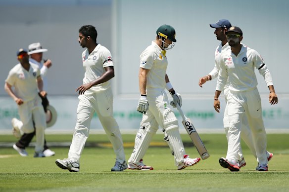 Shane Watson leaves the field after getting out to Varun Aaron.