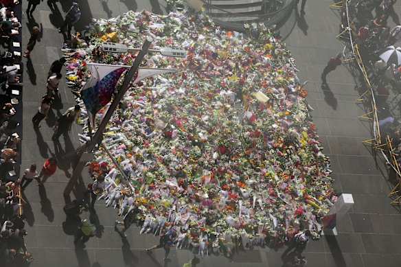 Thousands of bouquets of flowers in Martin Place, as seen from above.
