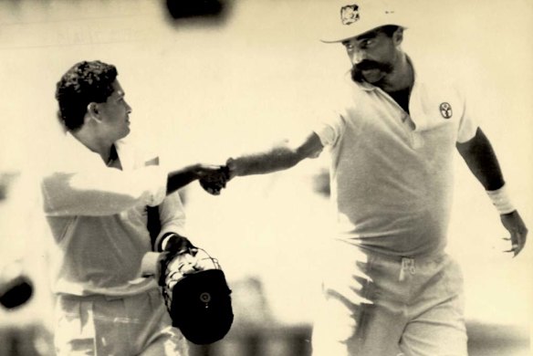 1992. Congratulated by Merv Hughes after scoring 148 not out at the SCG against Australia. Shane Warne made his debut (1-150) in the same match, Tendulkar's third on Australian soil, which ended in a draw.