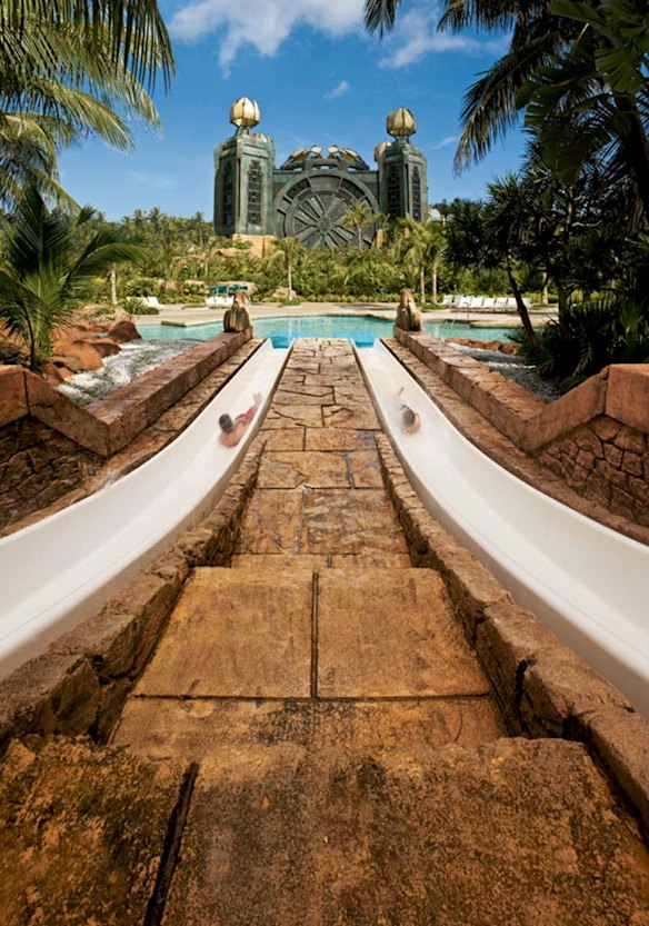 Guests can race down twin water slides at the Atlantis Paradise Island Resort in the Bahamas. 