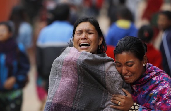 Family members break down during the cremation of an earthquake victim in Bhaktapur near Kathmandu, Nepal, Sunday, April 26, 2015. 