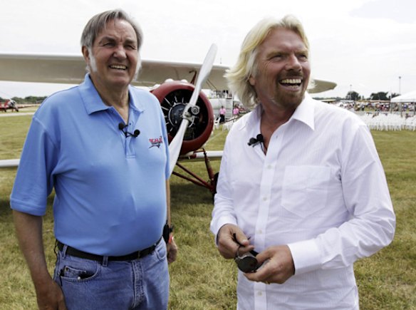 Burt Rutan, the designer of Virgin Mothership Eve, and Richard Branson, founder of the Virgin Group of companies, watch an Air Force Thunderbird F-16 ready for flight while waiting to watch the landing of WhiteKnight2.