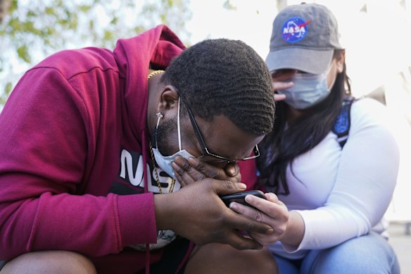 London Williams, 31, of Harrisburg, Pa., bursts into tears, in Washington, after hearing that former Minneapolis police Officer Derek Chauvin was convicted of murder and manslaughter in the death of George Floyd. 